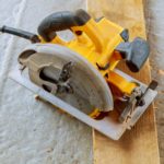 Close up electric circular saw cutting wood Wood cutting with circular saw